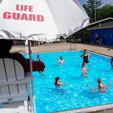 Campers swim in the pool, on June 20, at YMC Camp Kern in Oregonia, Ohio. The employment rate among returning students — those trying to find summer jobs before returning to school full-time in the fall — fell to 46.8 per cent in June. 