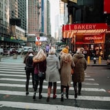 A group of women walking down a road in New York City in 2019.