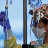 A nurse attends to a COVID-19 patient on a ventilator in the intensive care unit of Humber River Hospital in Toronto in this file photo. (Evan Mitsui/CBC)