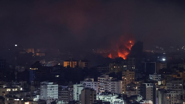 Fire and smoke rise over Beirut's southern suburbs after an airstrike.