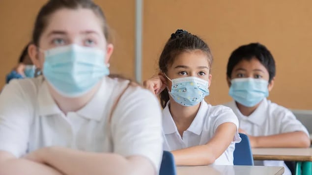 Effective Monday, Alberta K-12 students are no longer required to mask up. An application for an emergency injunction, filed Sunday, asks that the public health order exempting students from wearing masks in school be rescinded pending a judicial review. (Graham Hughes/The Canadian Press)