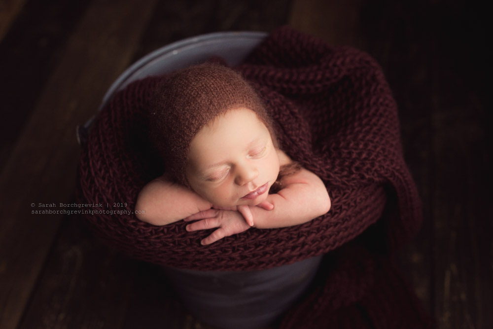 Baby boy in a bucket newborn session