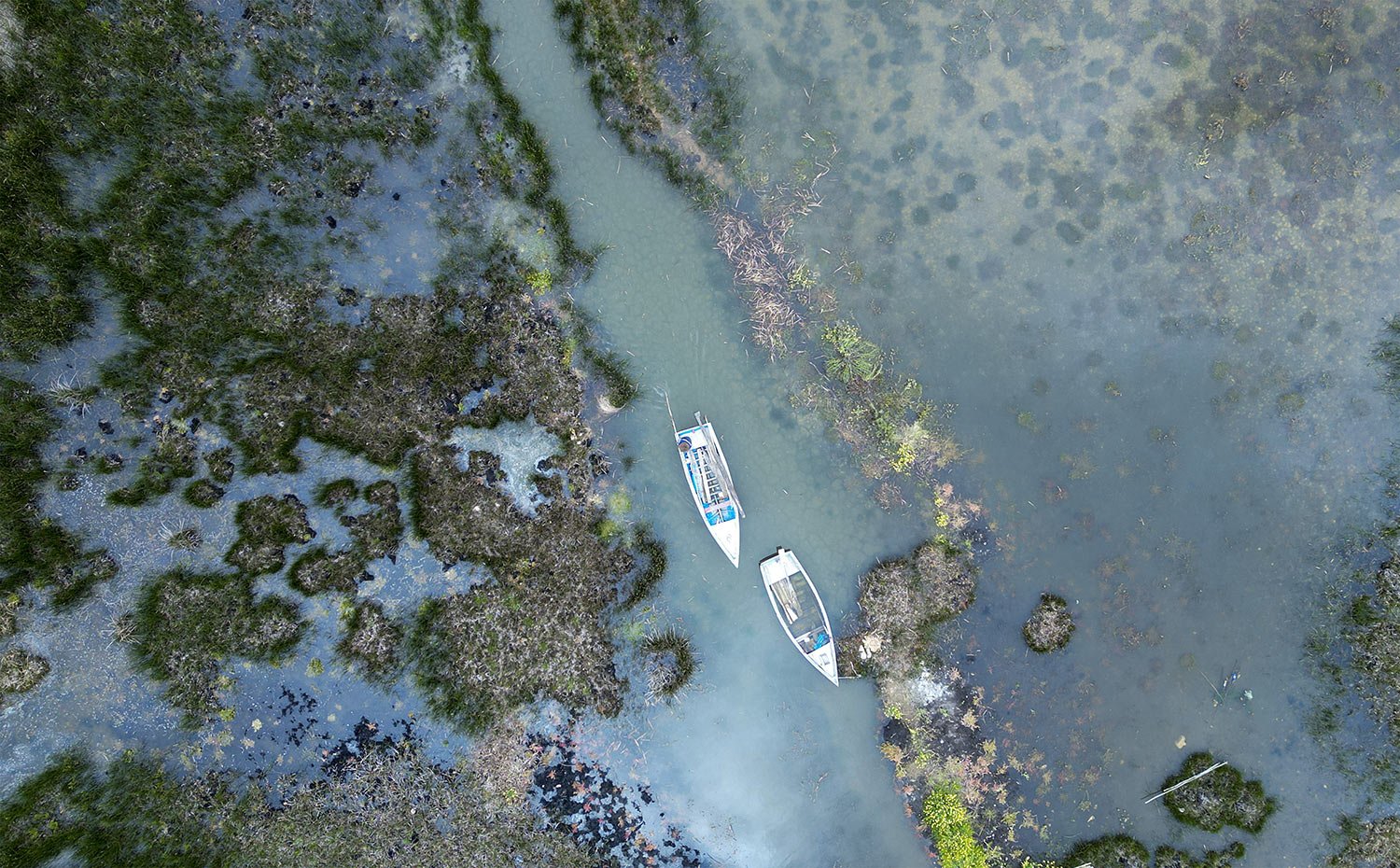  Boats float along the flooded shores of Lake Titicaca in Isla de Cojata, Bolivia, March 9, 2024.  (AP Photo/Juan Karita) 