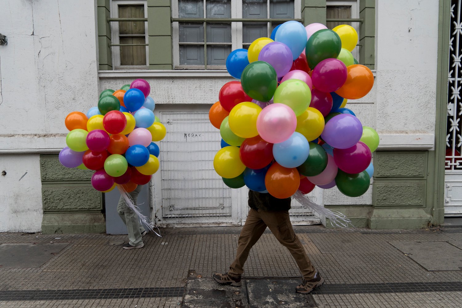  Protesters carry balloons to a march on International Workers' Day in Santiago, Chile, May 1, 2024. (AP Photo/Matias Basualdo) 