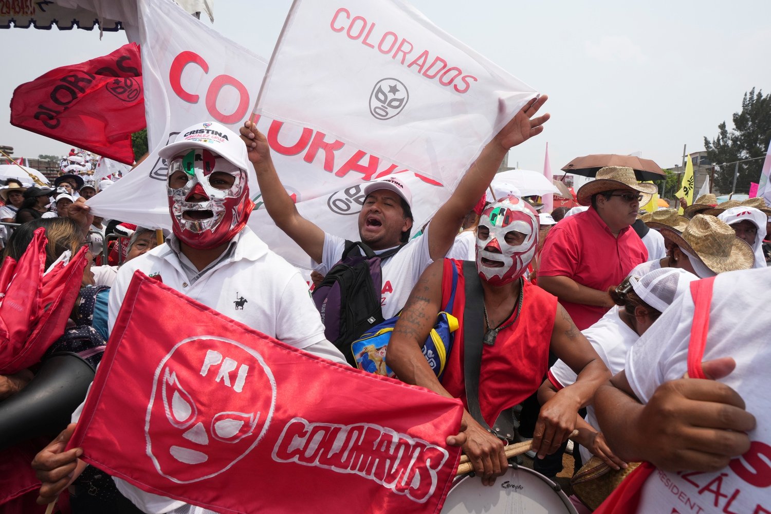  Some wearing Lucha Libre wrestling masks, supporters of opposition presidential candidate Xochitl Galvez chant her name at her closing campaign rally in Los Reyes la Paz on the outskirts of Mexico City, May 29, 2024. (AP Photo/Fernando Llano) 