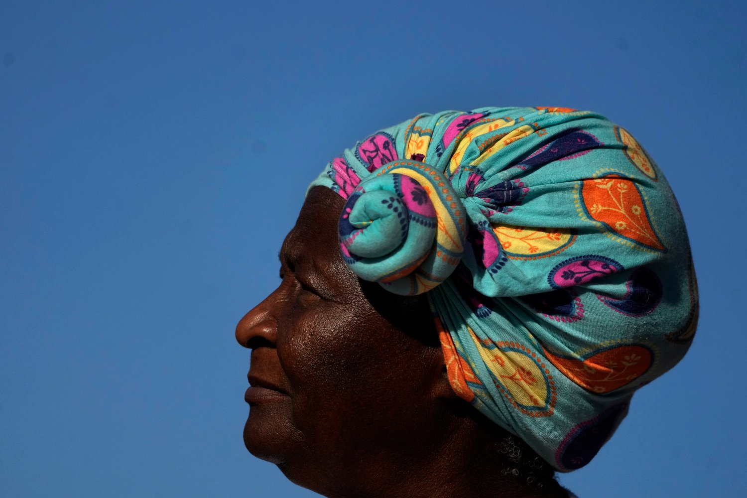  A woman attends a march demanding the enforcement of rights for Afro-Brazilians and the demarcation of Quilombos, territories where communities descended from slaves live in Brasilia, Brazil, May 16, 2024. (AP Photo/Eraldo Peres) 