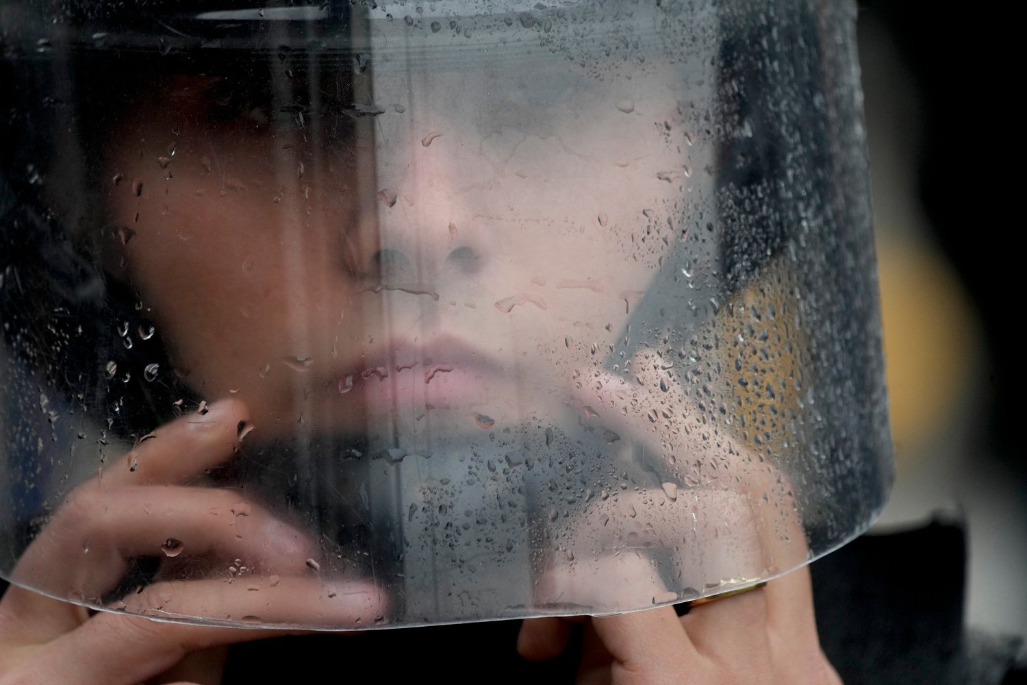  A police officer adjusts her helmet near an anti-government protest against food scarcity at soup kitchens and economic reforms proposed by President Javier Milei, in Buenos Aires, Argentina, May 7, 2024. (AP Photo/Natacha Pisarenko) 