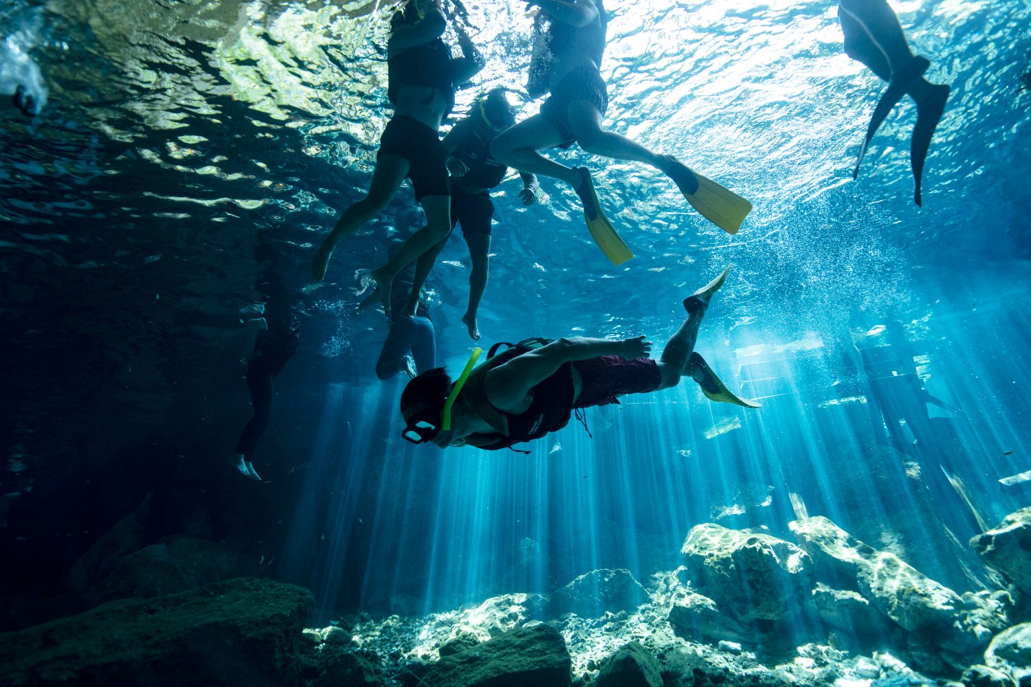  Tourists swim in the cenote "Dos Ojos," or Two Eyes, on the outskirts of Playa del Carmen, Mexico, March 9, 2024. These glowing sinkhole lakes, known as cenotes, are a part of one of Mexico's natural wonders: A fragile system of thousands of subterr