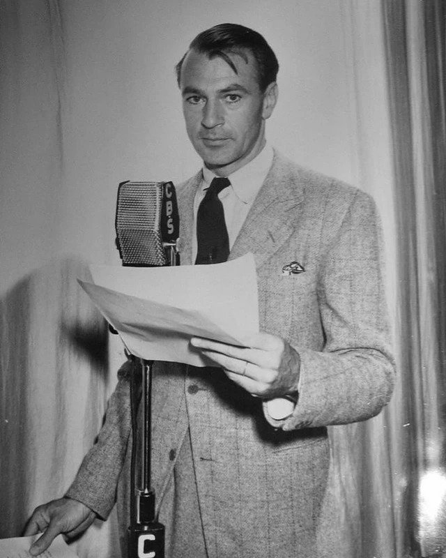 Behind the mic! 🎙️ Here's Gary Cooper at NBC preparing for voiceovers&mdash;proving that his talents extended beyond the screen. A true legend of his craft.