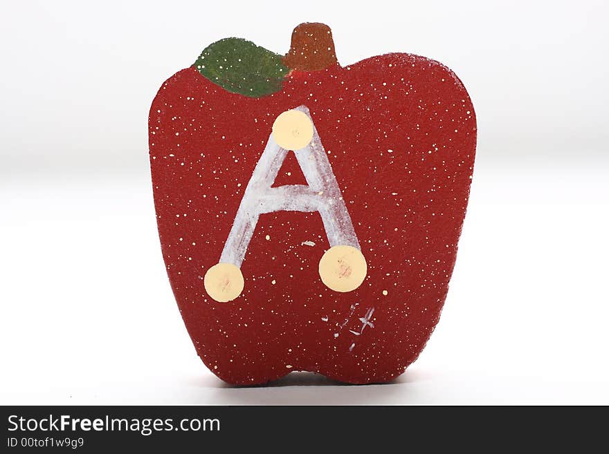 Wooden Apples with the letter A painted on it. Wooden Apples with the letter A painted on it.