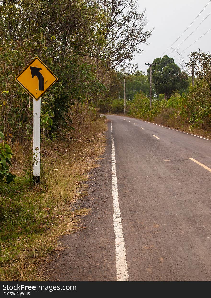 Yellow traffic sign, turn left.