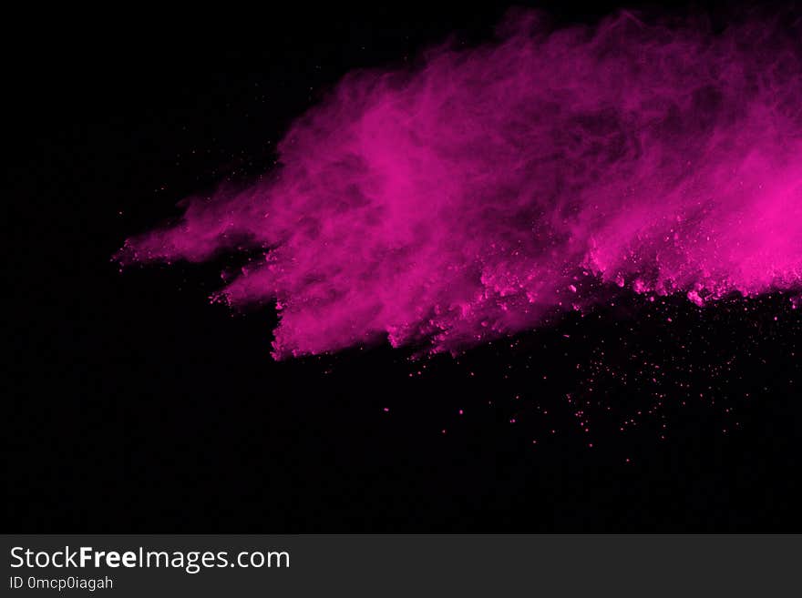 Abstract pink powder explosion on black background. abstract colored powder splatted, Freeze motion of pink powder exploding.