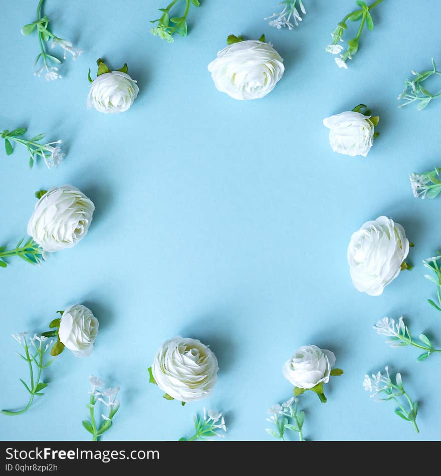 Abstract composition of spring flowers on blue  background.