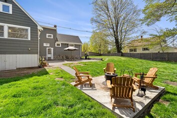 Fenced-in yard with fire pit.