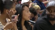 Angel Reese, Kysre Gondrezick and Brown courtside.