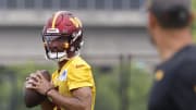 Jun 5, 2024; Ashburn, VA, USA; Washington Commanders quarterback Jayden Daniels (5) prepares to pass the ball during OTA workouts at Commanders Park. Mandatory Credit: Geoff Burke-USA TODAY Sports