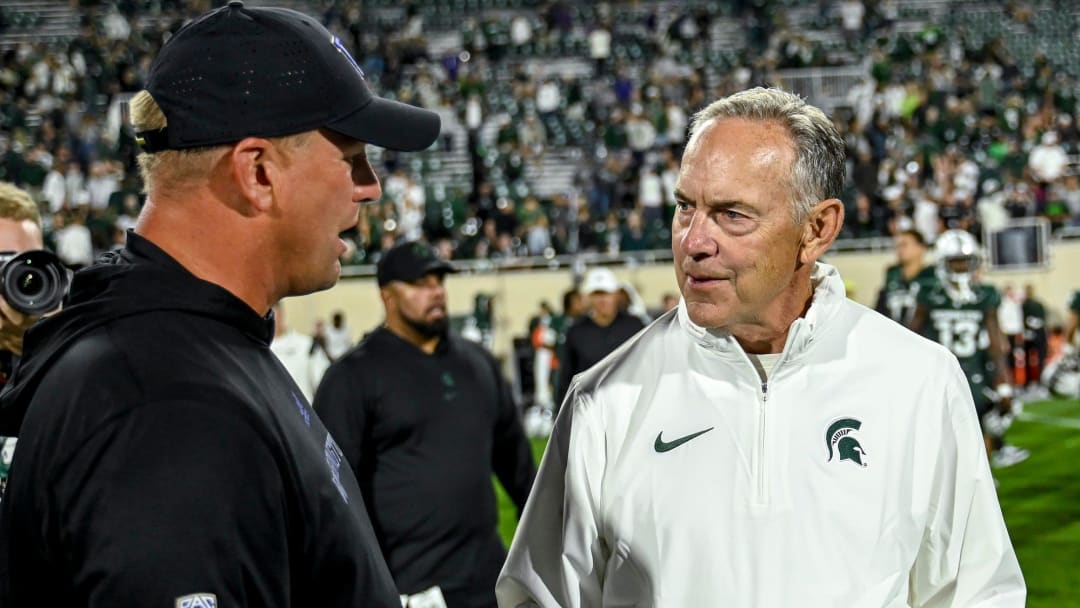 Michigan State's associate head coach Mark Dantonio, right, talks with Washington head coach Kalen DeBoer after the Spartans loss on Saturday, Sept. 16, 2023, at Spartan Stadium in East Lansing.