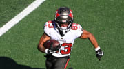 Jan 7, 2024; Charlotte, North Carolina, USA; Tampa Bay Buccaneers wide receiver Deven Thompkins (83) with the ball as Carolina Panthers cornerback Jaycee Horn (8) defends in the first quarter at Bank of America Stadium. Mandatory Credit: Bob Donnan-USA TODAY Sports