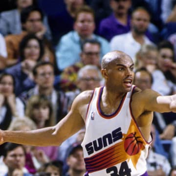 Unknown date 1996; Phoenix, AZ, USA; FILE PHOTO; Phoenix Suns forward Charles Barkley (34) is defended by Seattle Supersonics forward Detlef Schrempf (11) at America West Arena. Mandatory Credit: USA TODAY Sports