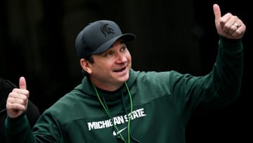 Michigan State's head coach Jonathan Smith gives a thumbs up to the crowd as he enters the field during the football Spring Showcase on Saturday, April 20, 2024, at Spartan Stadium in East Lansing.