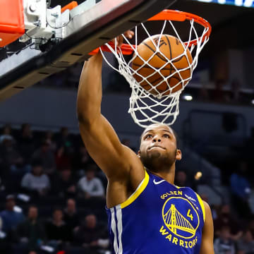 Jan 2, 2020; Minneapolis, Minnesota, USA; Golden State Warriors forward Omari Spellman (4) dunks the ball in the first quarter against the Minnesota Timberwolves at Target Center. Mandatory Credit: David Berding-USA TODAY Sports