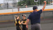 Watkins Memorial's Kyliee Trouten and Grace Whitman celebrate Whitman's diving catch on Friday, May 24, 2024.