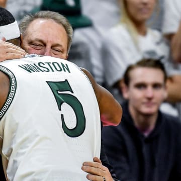 Michigan State's Cassius Winston, left, hugs head coach Tom Izzo after checking out of the game against Ohio State during the second half on Sunday, March 8, 2020, at the Breslin Center in East Lansing.