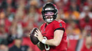 Jan 15, 2024; Tampa, Florida, USA; Tampa Bay Buccaneers quarterback Baker Mayfield (6) looks for a pass against the Philadelphia Eagles during the first half of a 2024 NFC wild card game at Raymond James Stadium. Mandatory Credit: Nathan Ray Seebeck-USA TODAY Sports