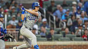  Los Angeles Dodgers shortstop Tommy Edman (25) hits a double against the Atlanta Braves during the second inning at Truist Park on Sept 15.