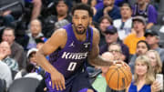 March 16, 2024; Sacramento, California, USA; Sacramento Kings guard Malik Monk (0) dribbles the basketball during the fourth quarter against the New York Knicks at Golden 1 Center. Mandatory 