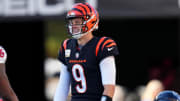 Nov 12, 2023; Cincinnati, Ohio, USA; Cincinnati Bengals quarterback Joe Burrow (9) smiles toward Houston Texans linebacker Denzel Perryman (6) on a fourth-down play in the second quarter of a Week 10 NFL football game between the Houston Texans and the Cincinnati Bengals at Paycor Stadium. Mandatory Credit: Kareem Elgazzar-USA TODAY Sports