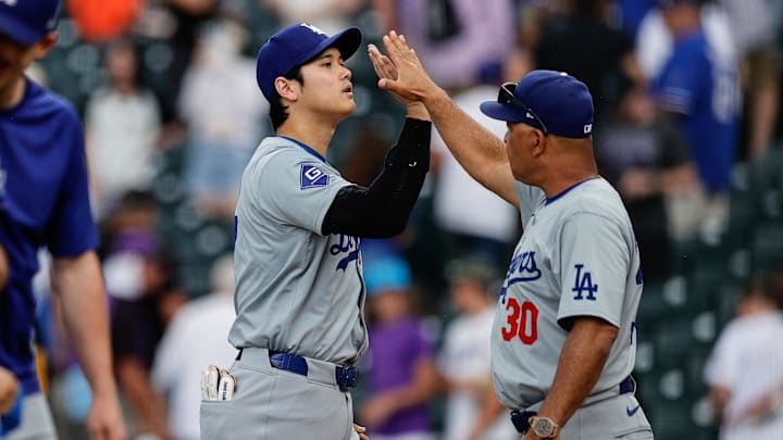 Jun 20, 2024; Denver, Colorado, USA; Los Angeles Dodgers designated hitter Shohei Ohtani (17) and manager Dave Roberts (30) celebrate after the game against the Colorado Rockies at Coors Field. Mandatory Credit: Isaiah J. Downing-Imagn Images