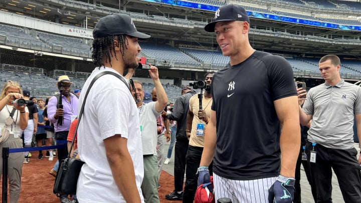 Jul 24, 2024; Bronx, New York, USA; New York Yankees center fielder Aaron Judge (99) talks to New York Knicks guard Jalen Brunson before a game against the New York Mets at Yankee Stadium. Mandatory Credit: Brad Penner-USA TODAY Sports