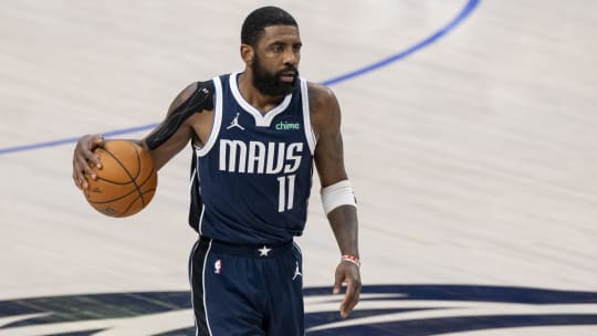 Mavericks guard Kyrie Irving dribbles the ball during Game 4 of the 2024 NBA Finals at American Airlines Center.