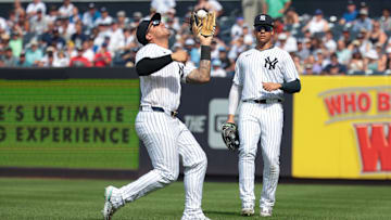 Aug 4, 2024; Bronx, New York, USA; New York Yankees second baseman Gleyber Torres (25) catches the ball for an out during the seventh inning against the Toronto Blue Jays in front of right fielder Juan Soto (22) at Yankee Stadium. Mandatory Credit: Vincent Carchietta-Imagn Images