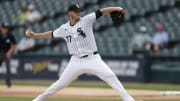 Aug 28, 2024; Chicago, IL, USA; Chicago White Sox starting pitcher Chris Flexen (77) delivers a pitch against the Texas Rangers during the first inning of game one of the doubleheader at Guaranteed Rate Field. Mandatory Credit: Kamil Krzaczynski-USA TODAY Sports