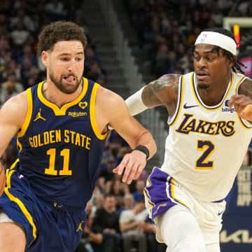 Jan 27, 2024; San Francisco, California, USA; Golden State Warriors guard Klay Thompson (11) dribbles against Los Angeles Lakers forward Jarred Vanderbilt (2) during the fourth quarter at Chase Center. Mandatory Credit: Darren Yamashita-USA TODAY Sports