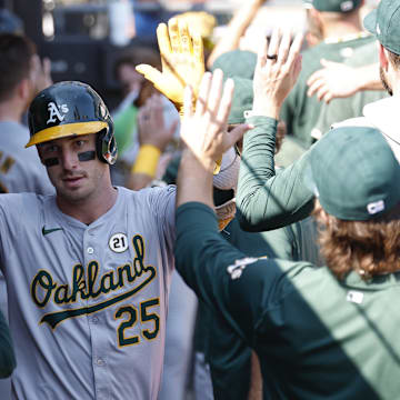 Oakland Athletics outfielder Brent Rooker (25) celebrates with teammates after hitting a two-run home run against the Chicago White Sox during the fifth inning at Guaranteed Rate Field on Sept 15.