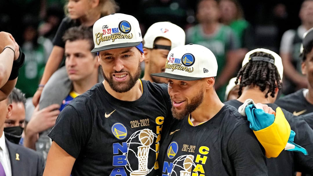 Jun 16, 2022; Boston, Massachusetts, USA; Golden State Warriors guard Stephen Curry (30) and guard Klay Thompson (11) celebrate after beating the Boston Celtics in game six of the 2022 NBA Finals to win the NBA Championship at TD Garden. Mandatory Credit: Kyle Terada-USA TODAY Sports