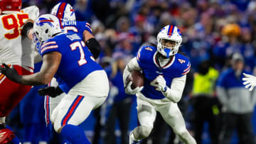 Jan 21, 2024; Orchard Park, NY; Buffalo Bills running back James Cook (4) against the Kansas City Chiefs in the 2024 AFC divisional round game at Highmark Stadium.