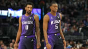 Mar 10, 2024; Sacramento, California, USA; Sacramento Kings guards Malik Monk (0) and De'Aaron Fox (5) during the first quarter against the Houston Rockets at Golden 1 Center. Mandatory Credit: Darren Yamashita-USA TODAY Sports