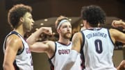 Dec 2, 2022; Sioux Falls, South Dakota, USA;  Gonzaga Bulldogs guard Julian Strawther (0) reacts with forward Drew Timme (2) and forward Anton Watson (22) after a basket against the Baylor Bears in the second half at Sanford Pentagon. Mandatory Credit: Steven Branscombe-USA TODAY Sports