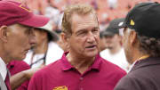 Sep 10, 2023; Landover, Maryland, USA; Former professional football player Joe Theismann (center) speaks with Washington Commanders limited partner Mitchell Rales (left) and minority stake owner Mark ein (right) before the Washington Commanders and Arizona Cardinals game at FedExField. Mandatory Credit: Brent Skeen-USA TODAY Sports