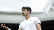 Jul 12, 2024; London, United Kingdom; Carlos Alcaraz (ESP) reacts after losing a point against Daniil Medvedev (not pictured) in a gentlemen's singles semifinal on day twelve of The Championships Wimbledon 2024 at The All England Lawn Tennis and Croquet Club.