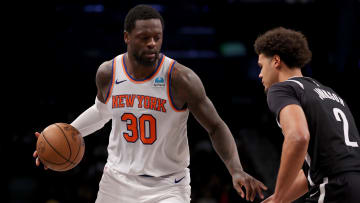 Jan 23, 2024; Brooklyn, New York, USA; New York Knicks forward Julius Randle (30) controls the ball against Brooklyn Nets forward Cameron Johnson (2) during the second quarter at Barclays Center. Mandatory Credit: Brad Penner-USA TODAY Sports