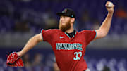 Aug 20, 2024; Miami, Florida, USA; Arizona Diamondbacks relief pitcher A.J. Puk (33) delivers a pitch against the Miami Marlins during the seventh inning at loanDepot Park. Mandatory Credit: Sam Navarro-Imagn Images