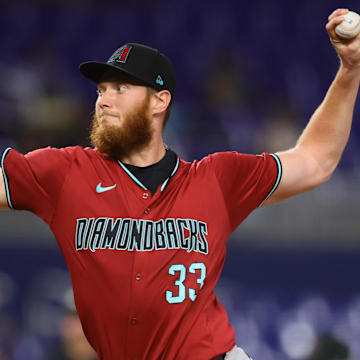 Aug 20, 2024; Miami, Florida, USA; Arizona Diamondbacks relief pitcher A.J. Puk (33) delivers a pitch against the Miami Marlins during the seventh inning at loanDepot Park. Mandatory Credit: Sam Navarro-Imagn Images