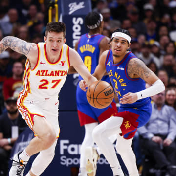 Apr 6, 2024; Denver, Colorado, USA; Atlanta Hawks guard Vit Krejci (27) drives down the court against the Denver Nuggets in the second half at Ball Arena. Mandatory Credit: Michael Ciaglo-USA TODAY Sports