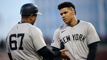 Jun 1, 2024; San Francisco, California, USA; New York Yankees outfielder Juan Soto (22) (right) talks with third base coach Luis Rojas (67) after the last out of the fifth inning against the San Francisco Giants at Oracle Park. Mandatory Credit: Robert Edwards-Imagn Images