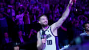 Apr 16, 2024; Sacramento, California, USA; Sacramento Kings forward Domantas Sabonis (10) celebrates after the Kings defeated the Golden State Warriors during a play-in game of the 2024 NBA playoffs at the Golden 1 Center. Mandatory Credit: Cary Edmondson-USA TODAY Sports